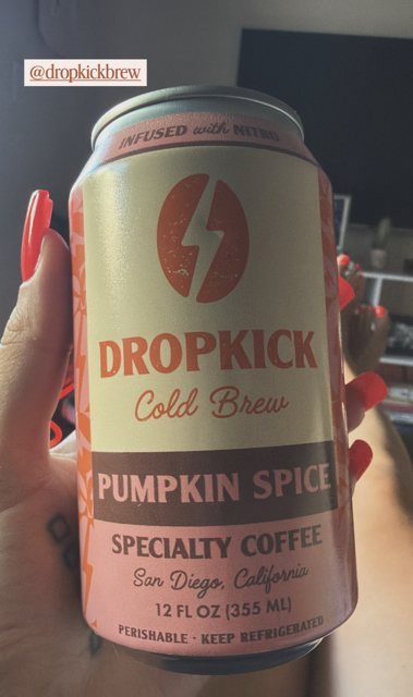 Close-up of a DropKick Pumpkin Spice can in hand