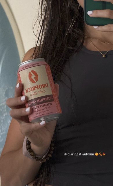 A member holding a Pumpkin Spice can, declaring it autumn