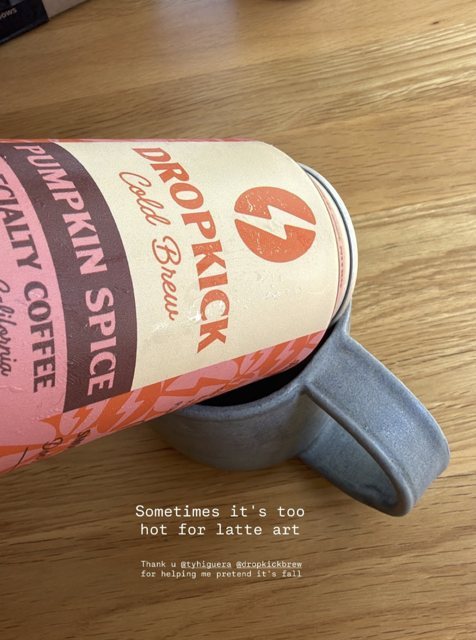 Pumpkin Spice can next to a mug for a latte